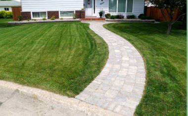 Curving brick walkway to house