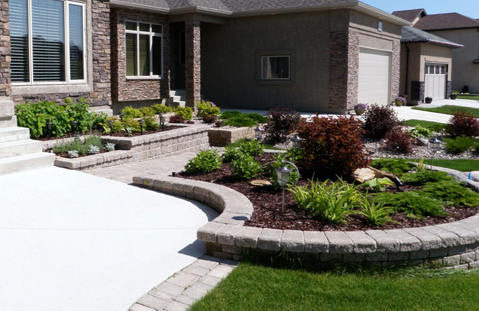 Highly structured Winnipeg patio with Roman Pisa planters on East Oak Drive